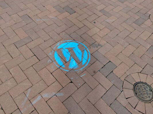 WordPress logo chalked on the ground